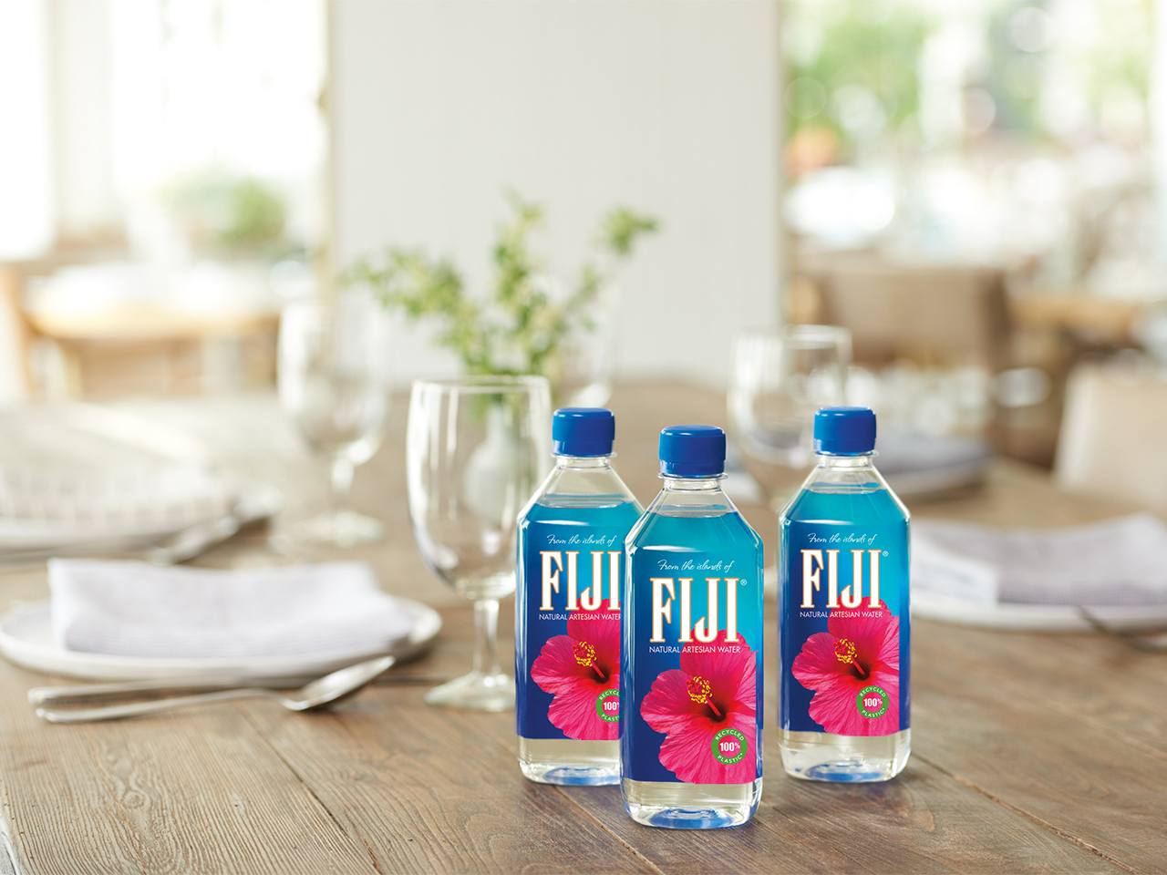 Fiji Water produces new cup holder-friendly bottle size - FoodBev Media